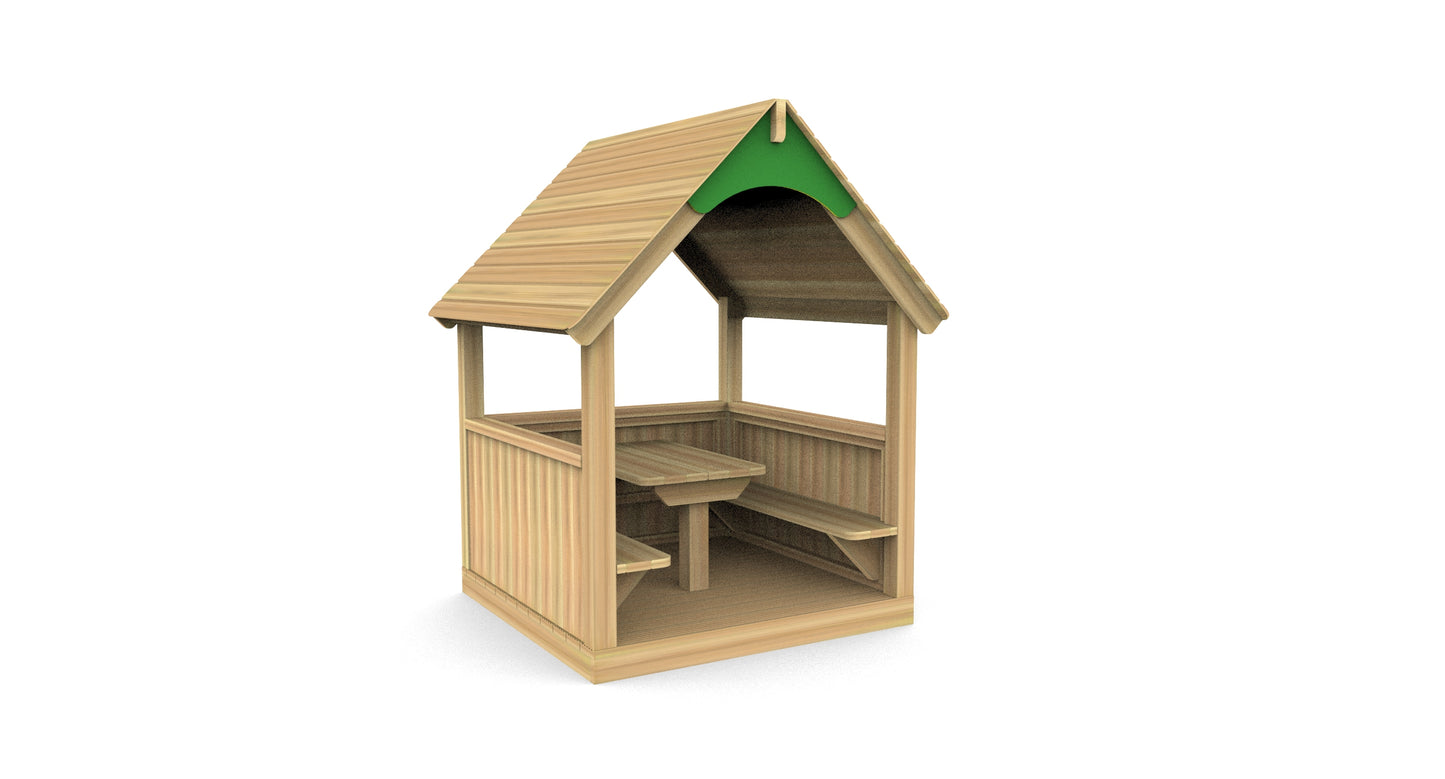 Wooden mini reading hut with a green roof, table, and benches